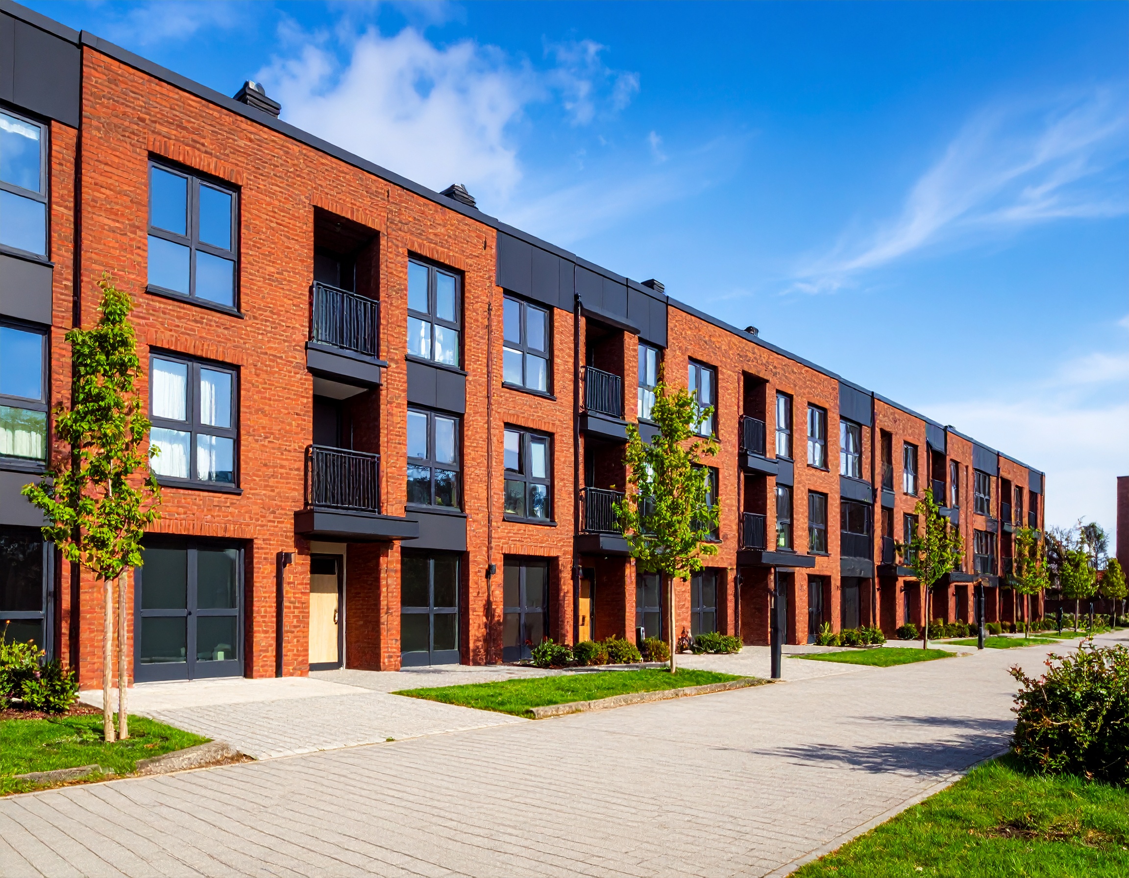 Clean and modern HMO or apartment block exterior in Manchester, UK, representing HMO and block management services by Delisa Miller